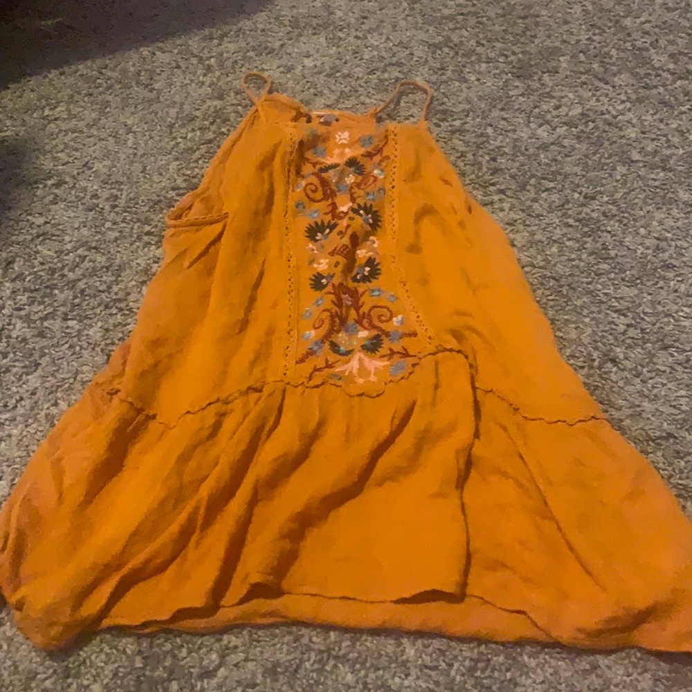 Orange tank top with flowers on it